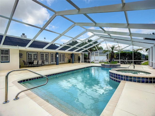 1281 N Timucuan Trl, Inverness, FL 34453 - view of pool featuring glass enclosure, an in ground hot tub, a patio, and french doors