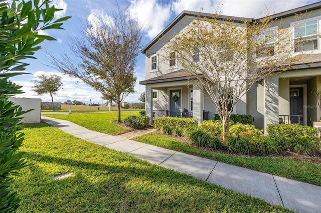 view of side of home with a lawn