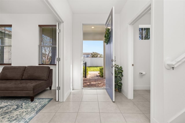 foyer entrance with light tile patterned floors