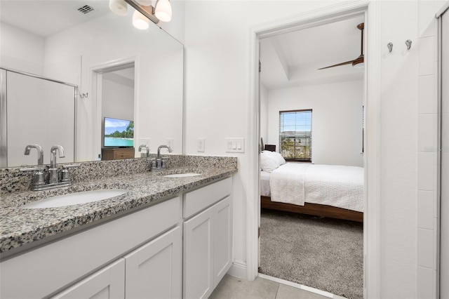 bathroom featuring vanity, tile patterned floors, a shower with door, and ceiling fan