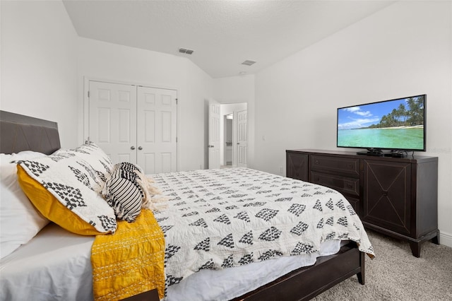 bedroom with carpet and a closet