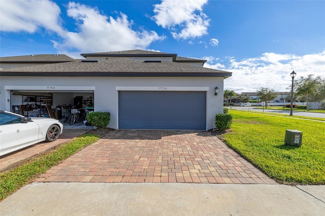 view of property exterior with a yard and a garage