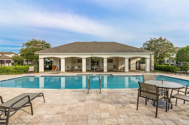 view of pool featuring a patio