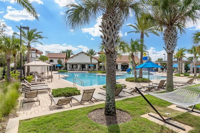 view of swimming pool featuring a patio area