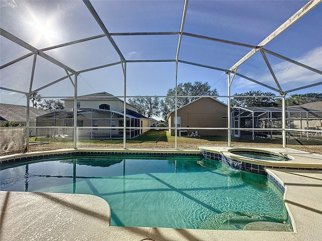 view of pool featuring an in ground hot tub and a lanai