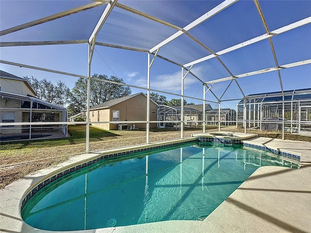 view of pool with a lanai and a patio area