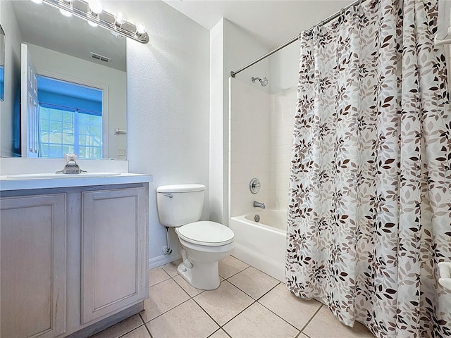 full bathroom with tile patterned flooring, vanity, shower / bath combination with curtain, and toilet