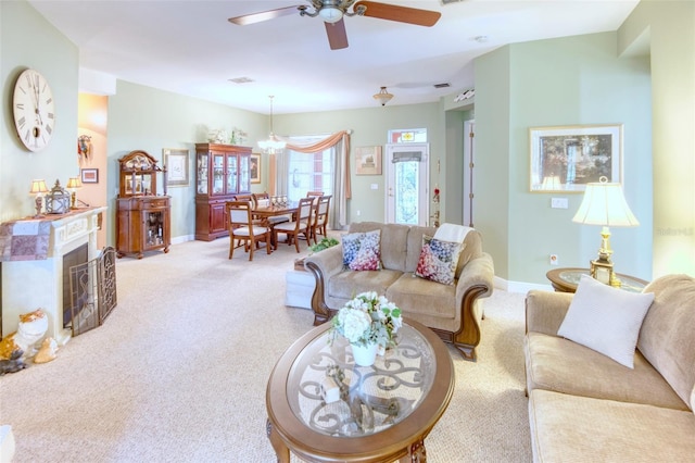 living room featuring carpet flooring and ceiling fan