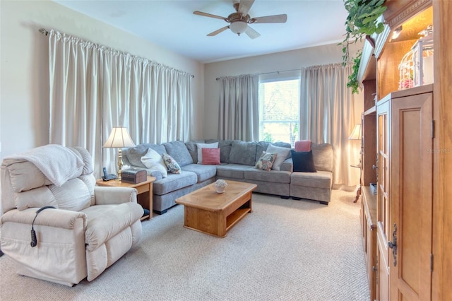 carpeted living room featuring ceiling fan