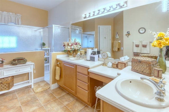 bathroom with tile patterned flooring, vanity, and a shower with shower door