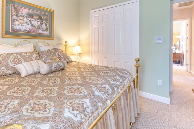 bedroom featuring a closet and carpet floors