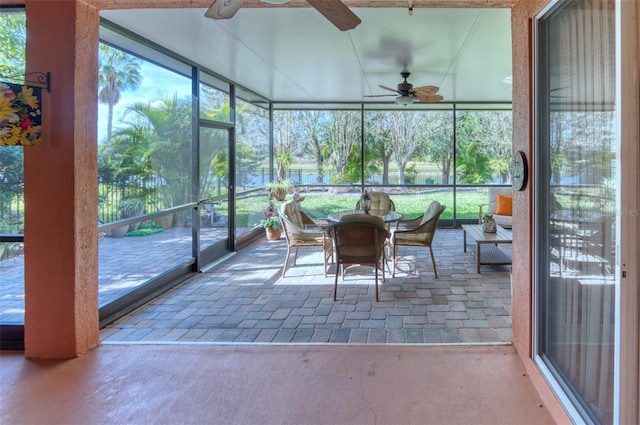 sunroom / solarium with ceiling fan