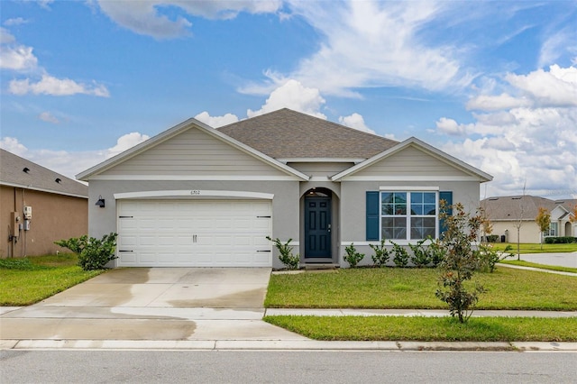 view of front facade with a front lawn and a garage