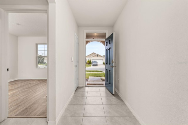 interior space featuring plenty of natural light and light tile patterned flooring