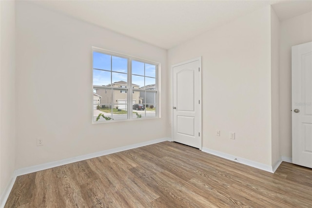 unfurnished room featuring light hardwood / wood-style floors