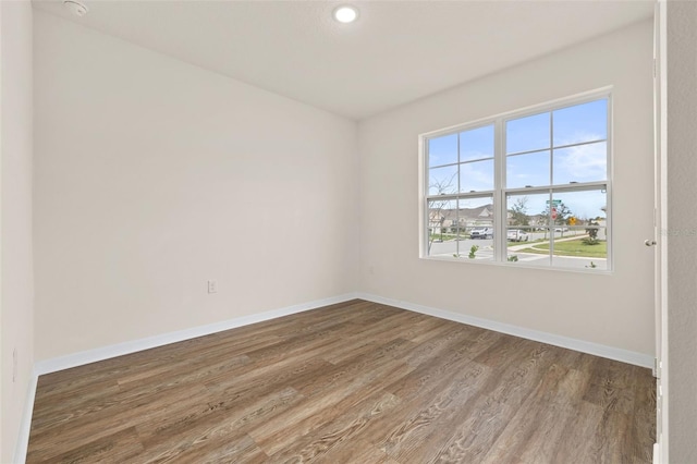 spare room featuring hardwood / wood-style floors