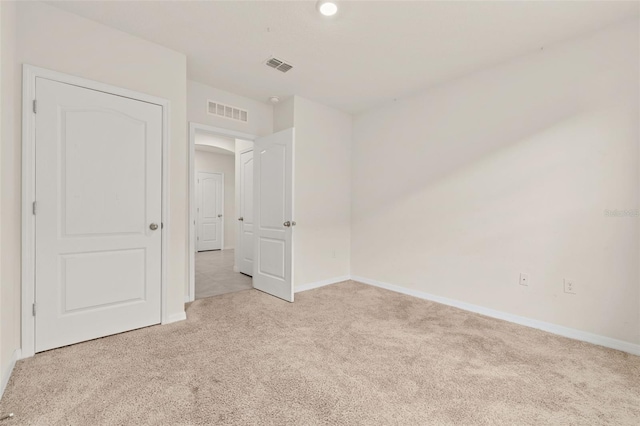 unfurnished bedroom with light carpet