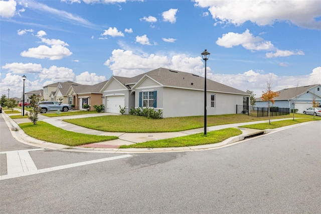 view of property exterior featuring a garage and a lawn