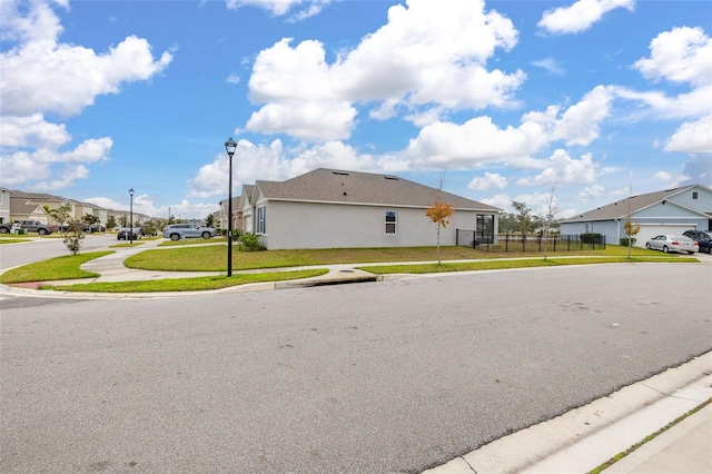 view of property exterior featuring a lawn