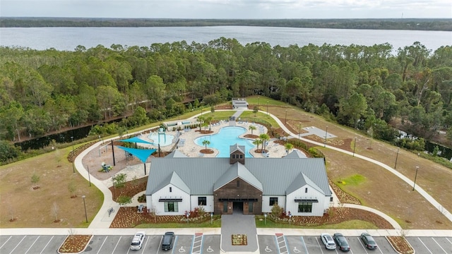 birds eye view of property with a water view