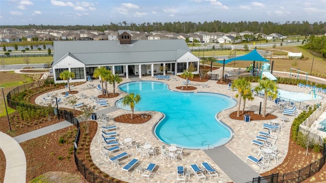 view of swimming pool with a patio