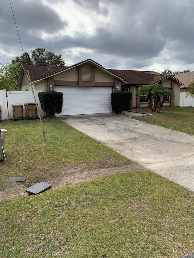 view of front facade featuring a front yard and a garage