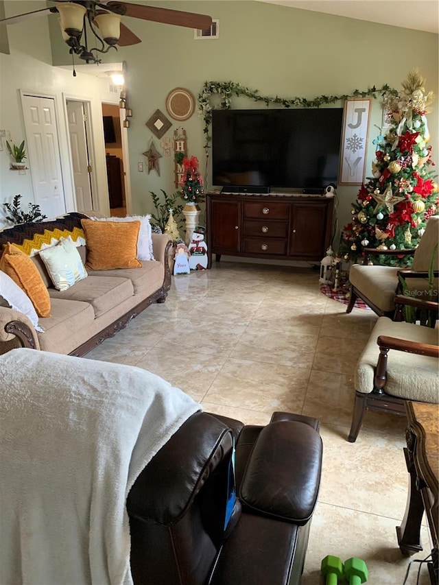 tiled living room with ceiling fan