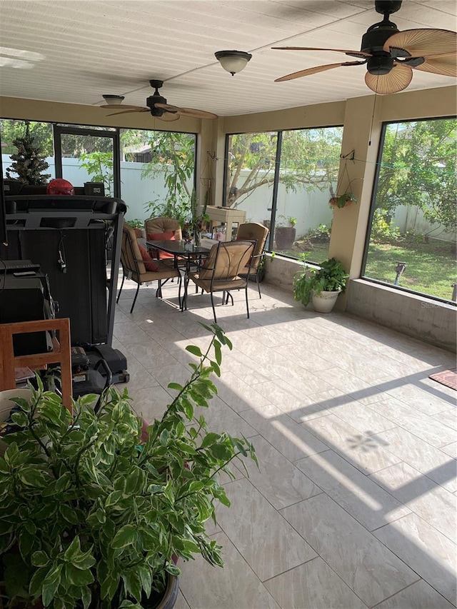 sunroom with a water view