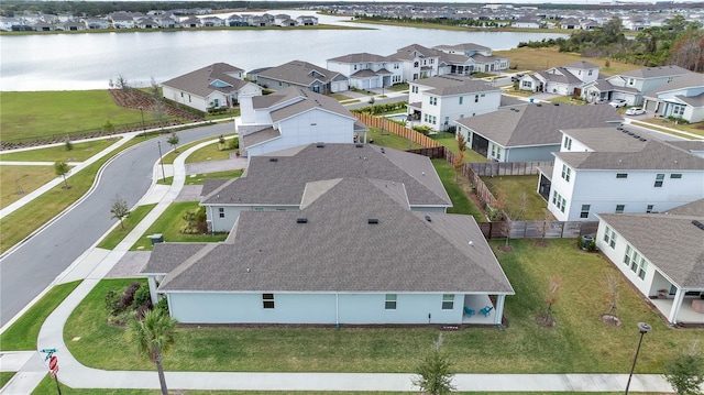 aerial view with a water view and a residential view