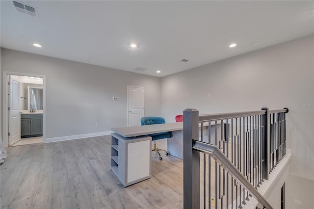 office area featuring baseboards, visible vents, light wood-style flooring, and recessed lighting