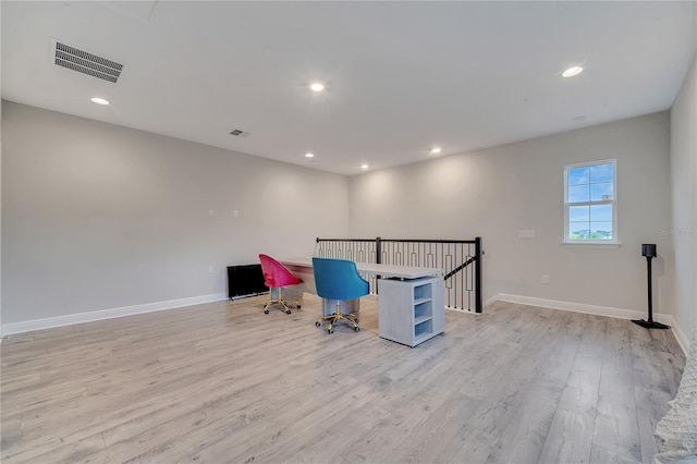 unfurnished office featuring recessed lighting, visible vents, light wood-style flooring, and baseboards