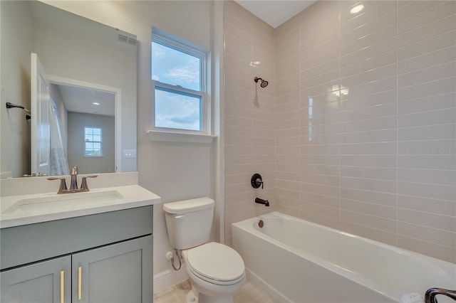 full bathroom with visible vents, baseboards, toilet, shower / tub combination, and vanity