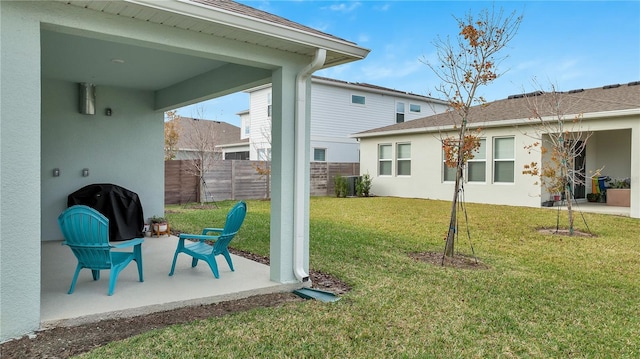 view of yard with a patio and fence