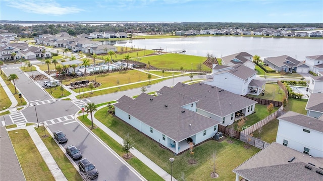 birds eye view of property with a residential view and a water view