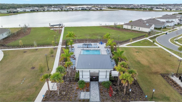 bird's eye view with a water view and a residential view