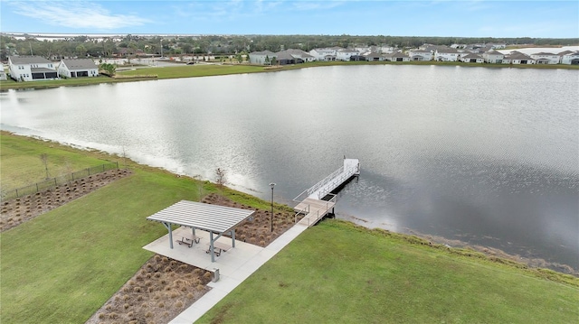 birds eye view of property with a residential view and a water view