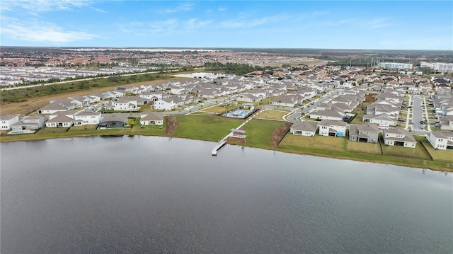 drone / aerial view featuring a water view and a residential view