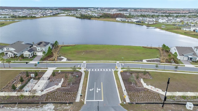 bird's eye view featuring a water view and a residential view