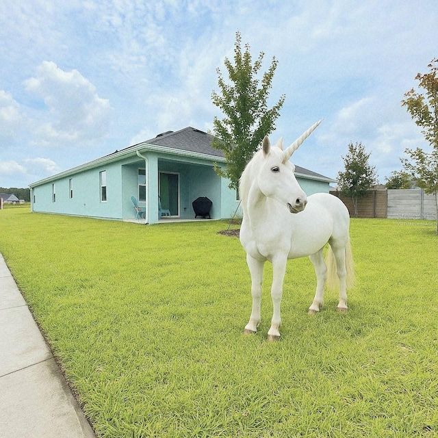 19041 Blueleaf St, Orlando, FL 32827 - exterior view of fence and stucco siding