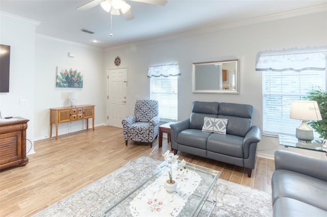 living room with crown molding, hardwood / wood-style floors, and ceiling fan