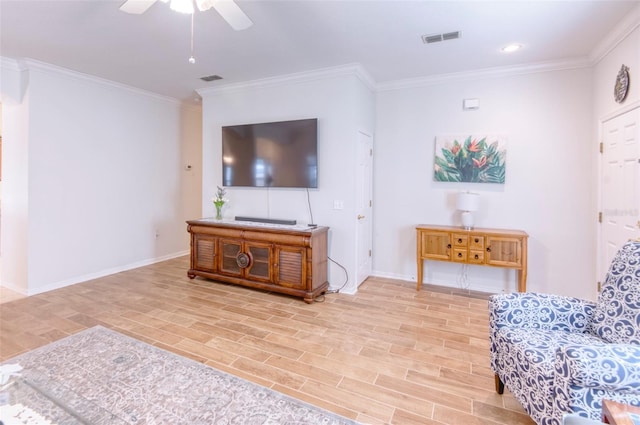 living room with ceiling fan and crown molding