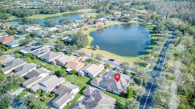 birds eye view of property featuring a water view