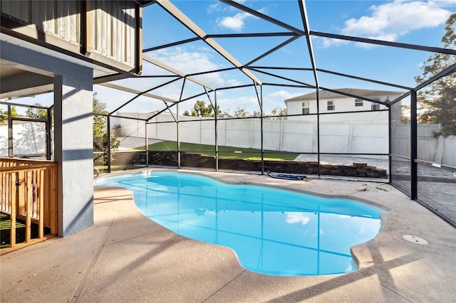 view of pool featuring a lanai and a patio area