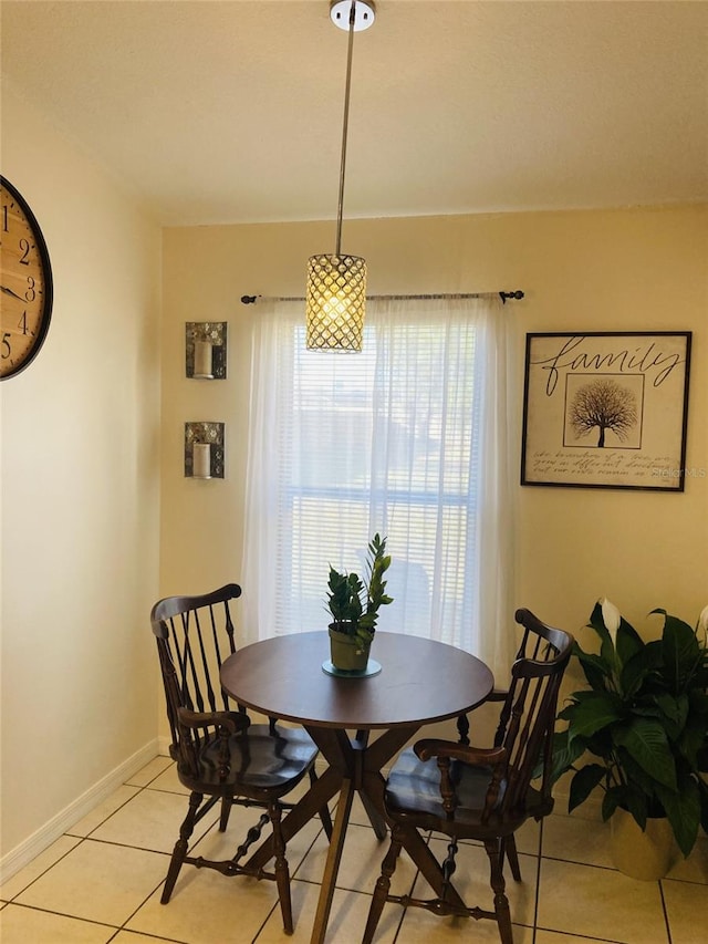 dining room featuring a wealth of natural light and light tile patterned floors