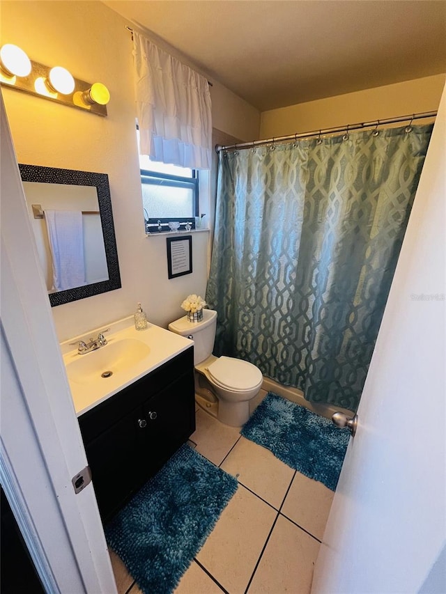 bathroom with toilet, a shower with shower curtain, tile patterned floors, and vanity