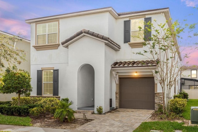 view of front of property with a garage