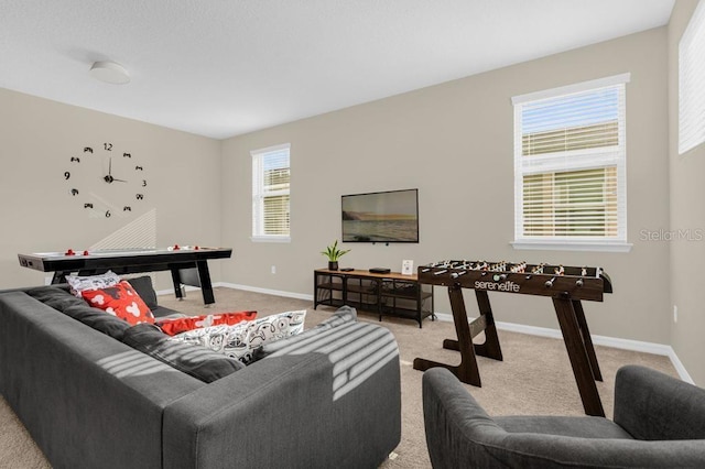 carpeted living room with a healthy amount of sunlight