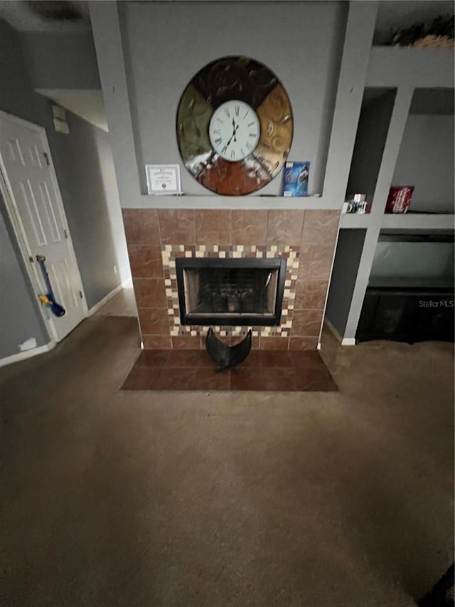 carpeted living room featuring a fireplace