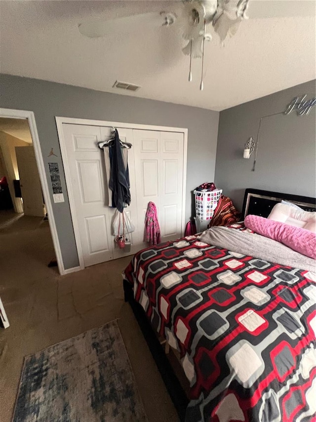 bedroom featuring ceiling fan, carpet floors, and a closet