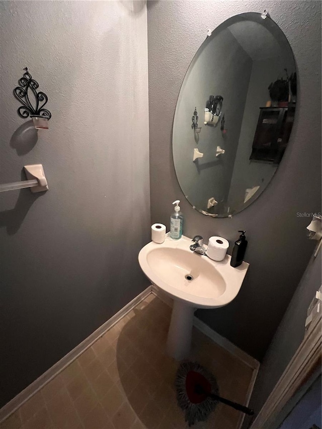 bathroom featuring tile patterned floors and sink